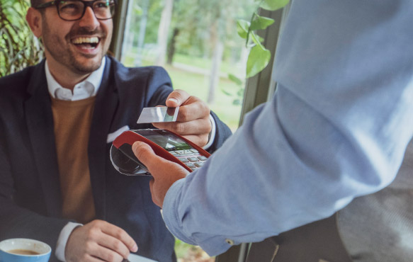 Man making payment from table.